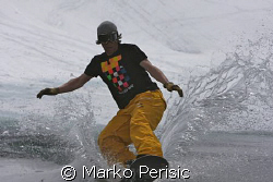 Surfin across Lac De Lou in the french alps on a snow boa... by Marko Perisic 